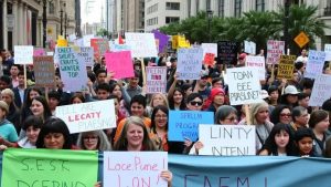 Public protests against social program cuts spark debate