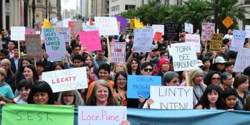 Public protests against social program cuts spark debate